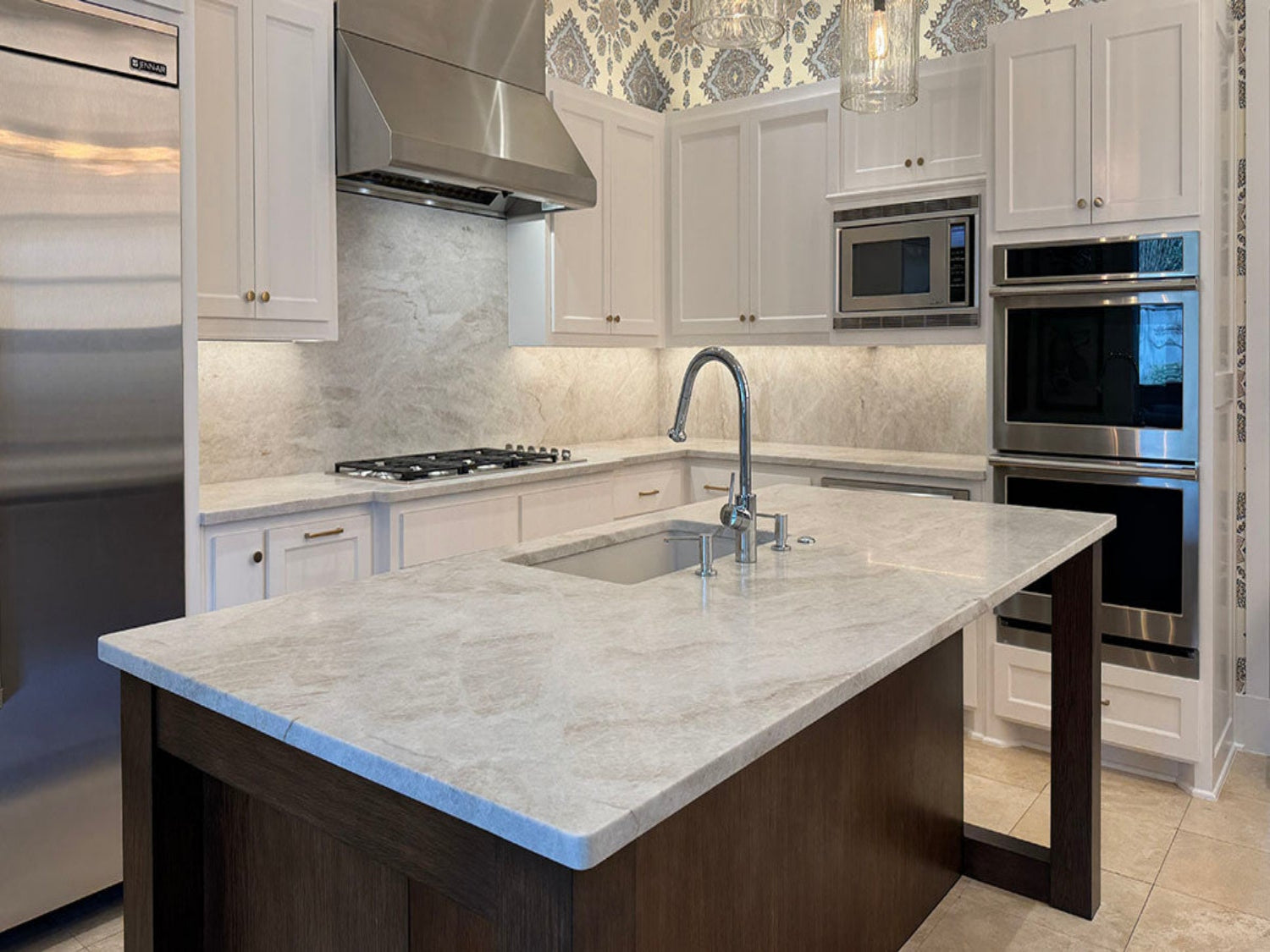 Classic Kitchen with leathered taj mahal countertops and island. Full backsplash with quartzite.