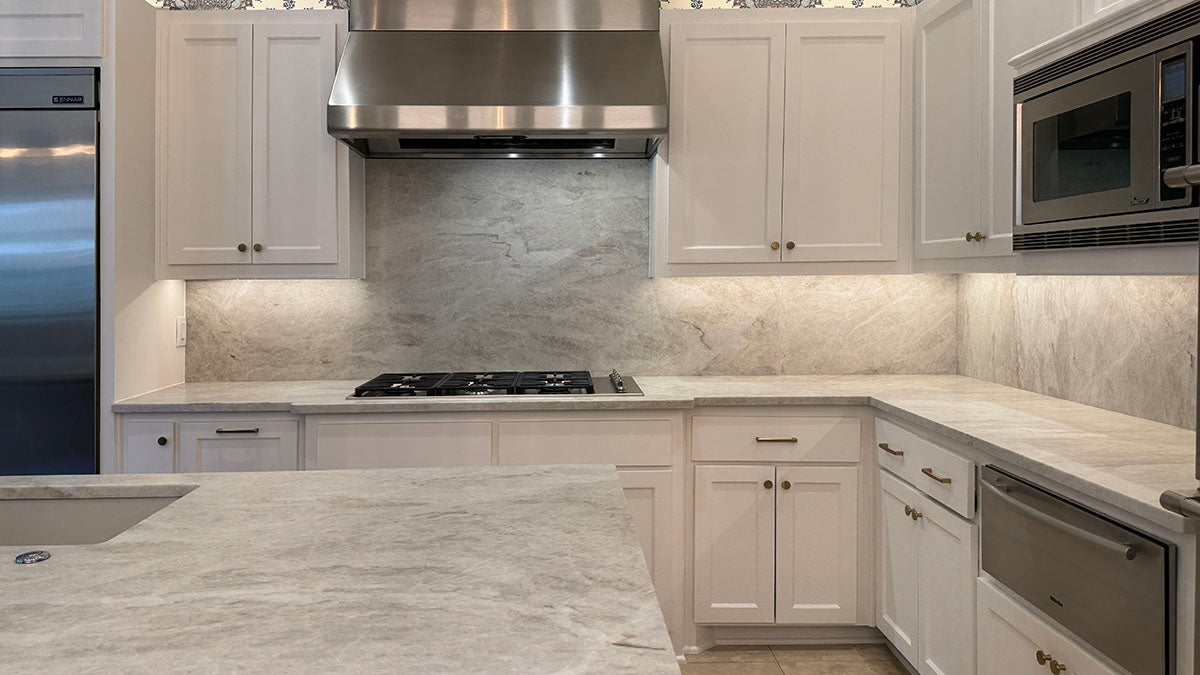 Full backsplash taj mahal leathered kitchen