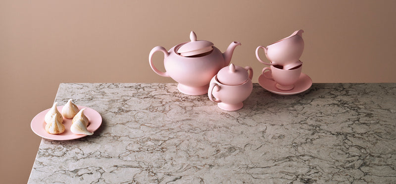 pink teacups on top of moorland fog countertops from caesarstone