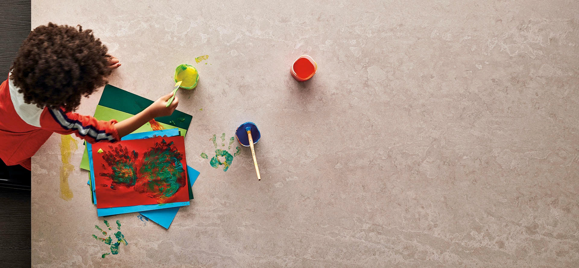 tops concrete table and kid using acrylic paint