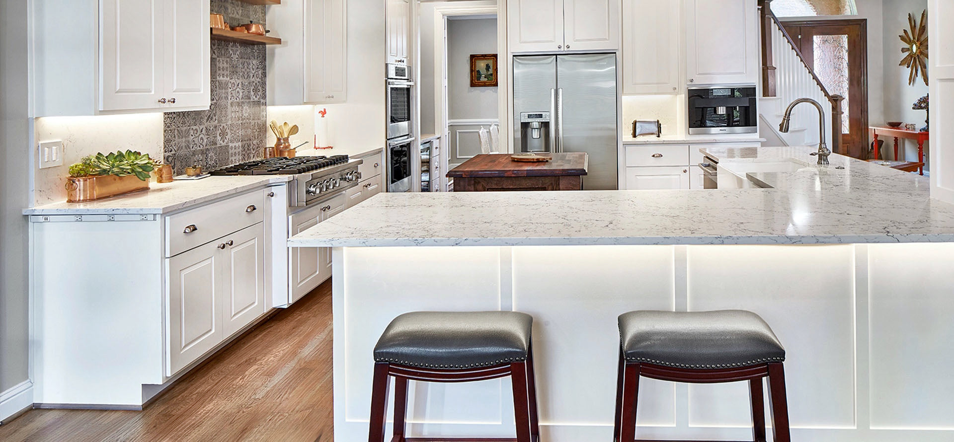 white attica countertops with white kitchen cabinets