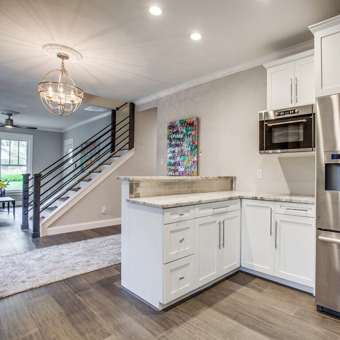 hite kitchen cabinets with fantasy brown granite countertops with aluminum backsplash subway tile