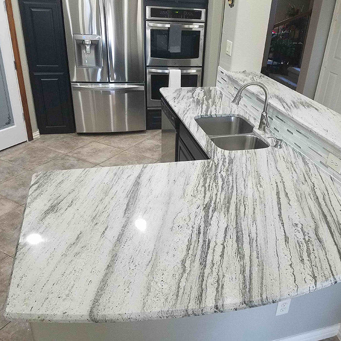 light grey granite with dark color cabinets