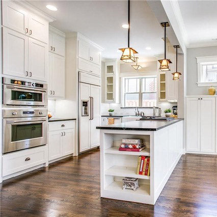 Dark soap stone countertops with white kitchen cabinets, white large cast iron farm sink
