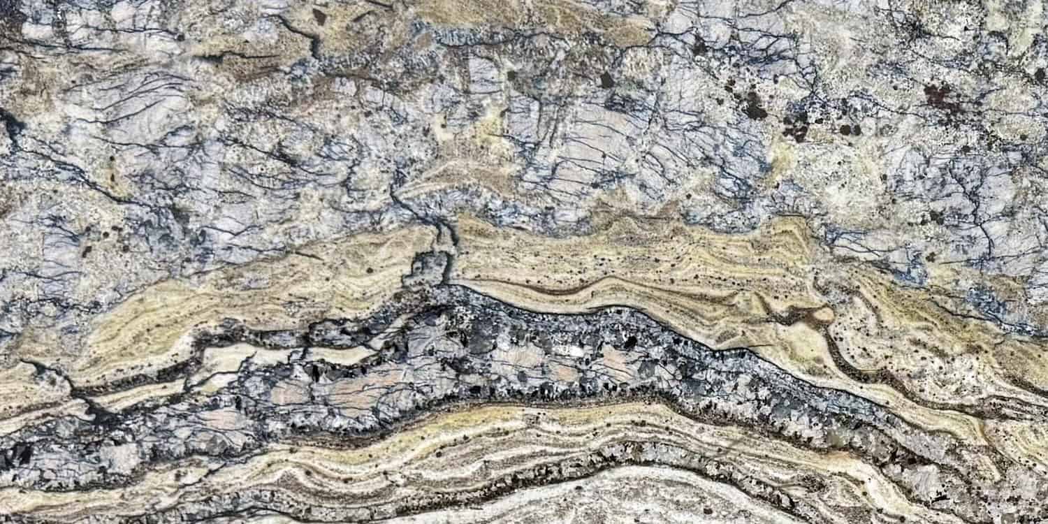 Close-up of a multicolored stone surface with patterns and textures.