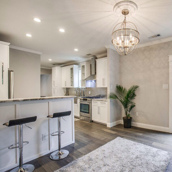 hite kitchen cabinets with fantasy brown granite countertops and stainless steel farm sink, aluminum backsplash subway tile