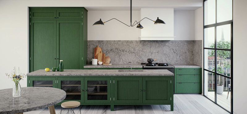 green kitchen cabinets with turbine grey countertops from caesarstone