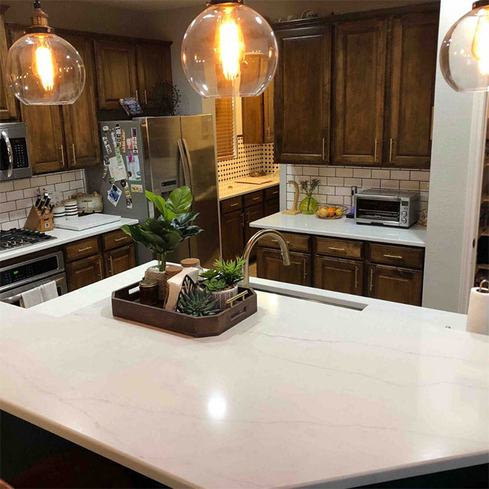 white calacatta quartz with brown cabinets
