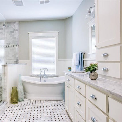 carrara marble bathroom countertops with white rectangular sinks and white cabinets