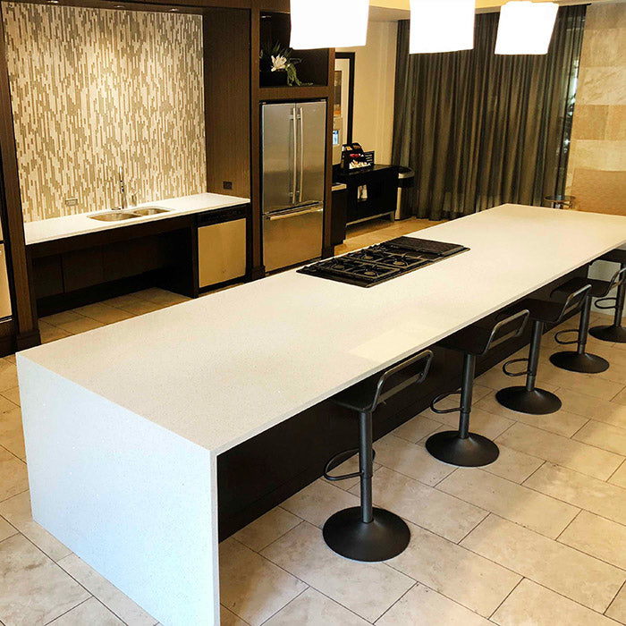 wahite sparkle quartz countertops with waterfall island