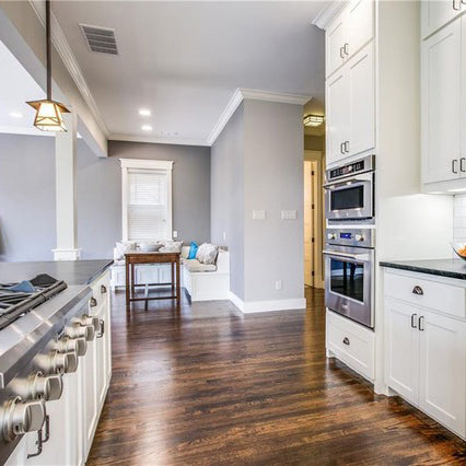 Dark soap stone with white kitchen cabinets 